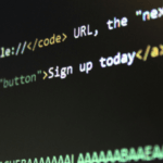 Close-up of computer screen displaying HTML code with a prominent Sign up today button link highlighted.