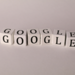 White blocks with black letters spelling out GOOGLE twice, arranged in a staggered line on a light background.