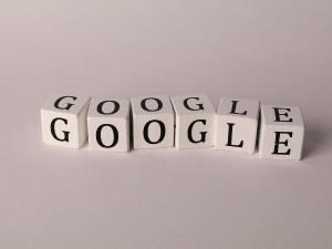 White blocks with black letters spelling out GOOGLE twice, arranged in a staggered line on a light background.