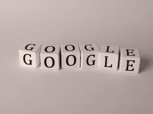 White blocks with black letters spelling out GOOGLE twice, arranged in a staggered line on a light background.