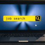 A laptop with a search bar that has "job search" written in it.