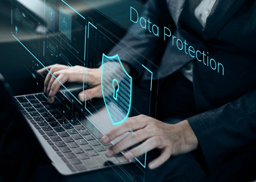 Person typing on a keyboard while their interaction is secured by data protection.