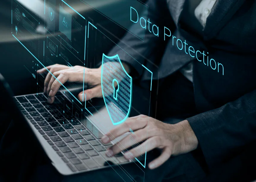 Person typing on a keyboard while their interaction is secured by data protection.